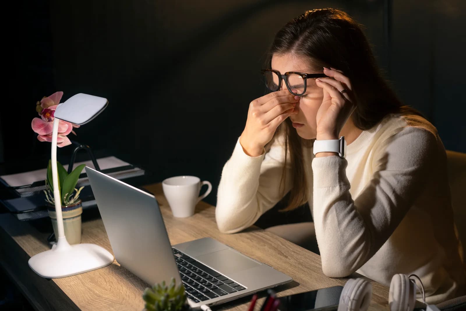 Person experiencing eye strain from prolonged screen use, illustrating Computer Vision Syndrome
